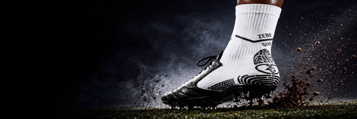 Zero Give soccer grip socks worn with soccer cleats